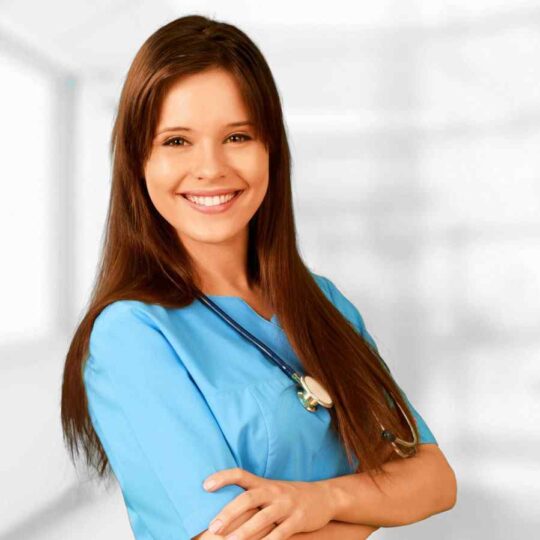 A woman smiling headshot wearing stethoscope